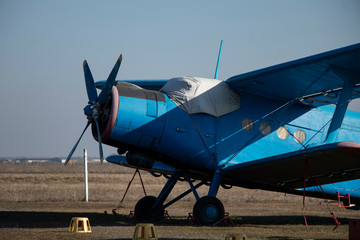 Old airplanes. Green and blue corncob. Sports plane of the 19th century. Until now they fly. Touch...