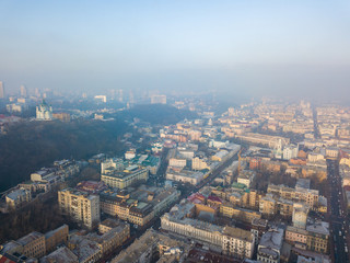 Aerial drone view. View of the historical part of Kiev on a foggy morning.