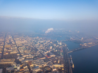 Obraz premium Aerial drone view. View of the historical part of Kiev and the Dnieper River on a foggy morning.