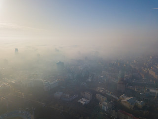 Aerial drone view. View of the city of Kiev in a foggy morning.