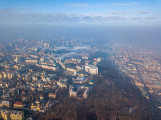 Fototapeta premium Aerial drone view. Houses in the city center of Kiev on a foggy morning.