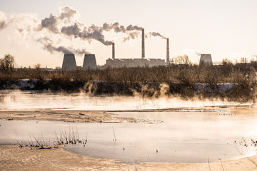 A power plant releases pollutants into the air and into a body of water. Environmental pollution