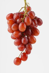 Red grape isolated over white background