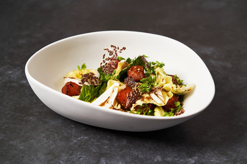 Baked Pumpkin salad with baked cheese, parsley herbs, white cabbage