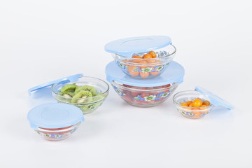 Household kitchen utensils; blue lid containers for fridge.