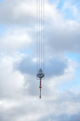 Crane hook hanging over an empty sky suspended in mid air