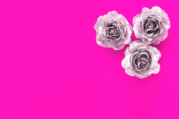 Pink background for text with silver glittering roses. Valentine day and love feminine concept.