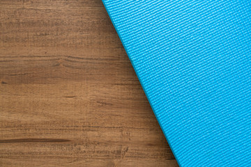 blue yoga mat on the table texture and background, sport concpet