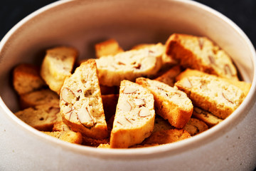 Sweet cookies with nuts on white bowl. Healthy snack