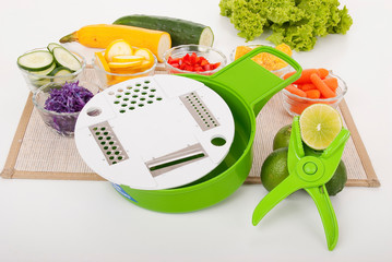 home kitchen  Grater food processor, photo on neutral background. © gonzalocalle