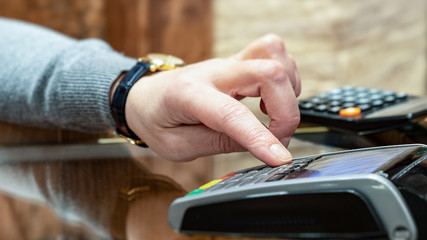 Payment by card, in the payment terminal. Electronic money. Mobile banking. Shopping complex.