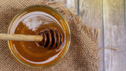 Honey is nutritious for health, stirring with a honey spoon 