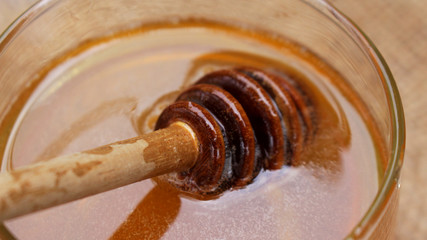 Honey is nutritious for health, stirring with a honey spoon 