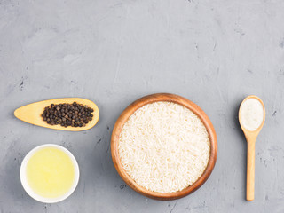 Ingredients for cooking basmati rice: butter, salt, black pepper. Healthy eating concept