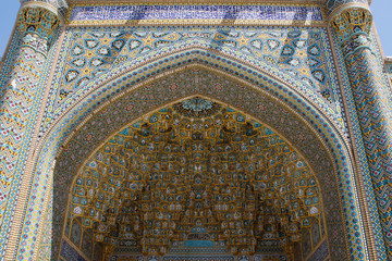 Fototapeta na wymiar Qum, Iran - May 4, 2017: stunning beauty of the ancient Shiite mosque Jamkaran is one of the primary signifier of mosques. Painting and mosaic details in blue color.