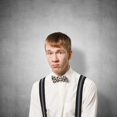 Unhappy young man looking at camera