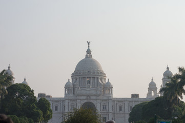Obraz premium The Victoria Memorial main building, an iconic infrastructure of the old Imperial British occupied Indian era, a museum and tourist destination and heritage place. Kolkata, West Bengal, India May 2019