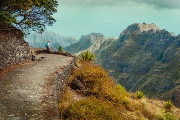 Santo Antao Island Cape Verde. Female tourist enjoying view to Caculi valley on hike from Corda