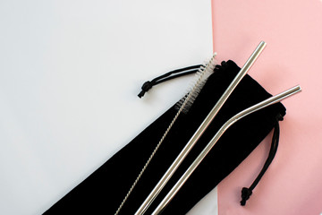 Reusable Metal Straws with Portable Case - Stainless Steel, Eco-Friendly Drinking Straw Set with  Cleaning Brushes & Travel Bag. Anti-Scratch Stainless Steel Straw Set of 2. Pink and white background.