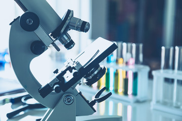 microscope instruments in science laboratory blue color tone background