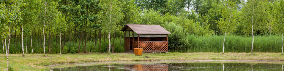 Holiday house near the lake. The concept of fishing and recreation