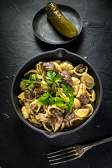 Italian pasta shells with beef sauce.