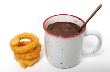Cup of chocolate sauce with churros
