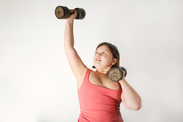Chubby fat preteen girl with large dumbbells