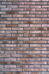 New brown-patterned brick facade. Background