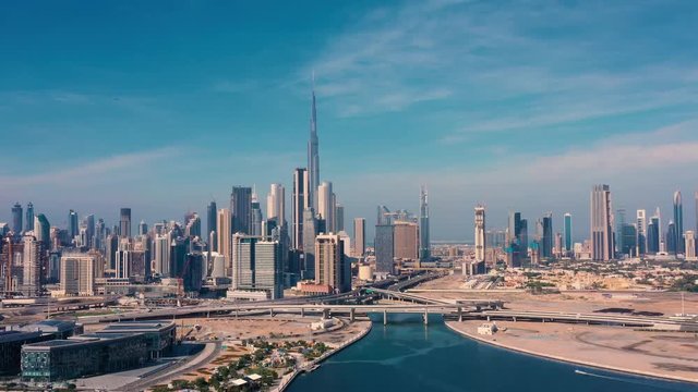 AERIAL. Drone video of Dubai city at day time. Modern city concept vith transport and river.