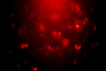 Background with red bokeh in the shape of a heart.