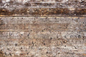 Rusty nails on wooden planks wall texture background