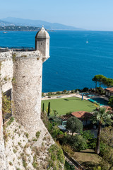 Fototapeta na wymiar Close view of historical Monte Carlo castel againt blue sea water in summertime in Monaco, France