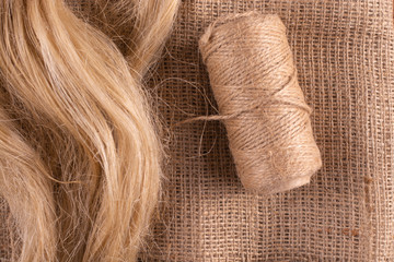Products from flax. Linen fabric, linseed oil, tow and a coil of flaxseed.