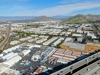 Aerial view to industrial zone and company storage warehouse in RIverside, California, USA