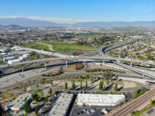 Fototapeta premium Aerial view to industrial zone and company storage warehouse in RIverside, California, USA