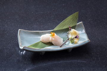 Hotate or sushi scallop the Japanese food menu on dish © John Kasawa