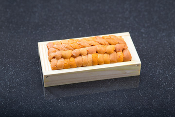 Fresh Ika no tamago squids eegs on the wooden tray