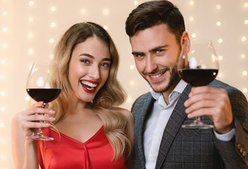 Happy Couple Holding Glasses With Red Wine, Toasting Valentine's Day