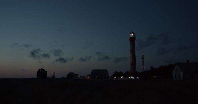 Lighthouse light blinking at night