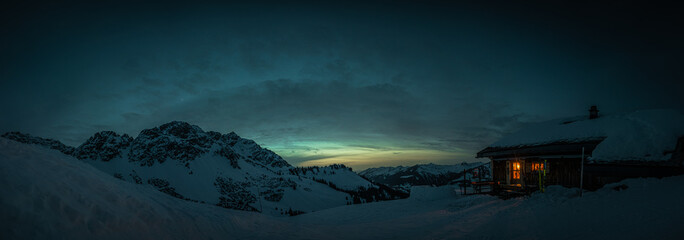 Evening mood in a lonely mountain hut in the Austrian Alps, summit of the Breithorn in the...