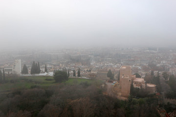 aerial view of the city Granada in the mroning fog from Alhambra citadel
