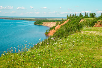 Fototapeta na wymiar Andoma Cape with Andoma Hill at Onega Lake, Vologda region, Russia. Natural background view