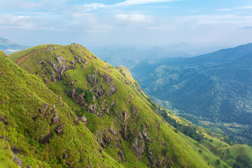Mountain landscape, green slopes. Beauty of mountains. Little Adam peak, mountain in the fog view from the jungle