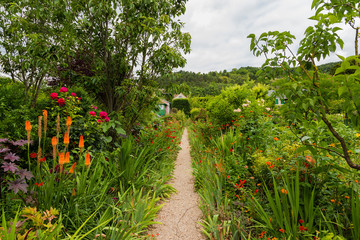 Giverny, France. Alley with exotic flowers in the park of Claude Monet