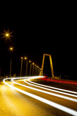 Fototapeta na wymiar Light Trails from Cars over Bridge in Umea, Sweden by Night