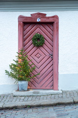 Red Wooden Door with Christmas Decoration