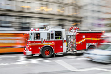 fire trucks and firefighters brigade in the city
