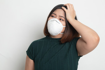 Young Asian woman wearing N95  mask to prevent PM2.5 dust air pollution