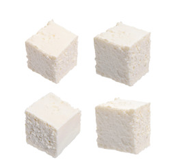 Ricotta cheese cube isolate on white. Macro focus stacking, clipping path.